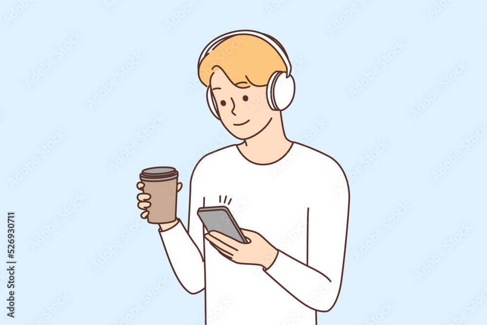 Man in headphones texting on smartphone Man in headphones texting on smartphone
