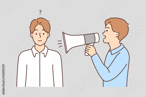 Man with megaphone shout at frustrated male 