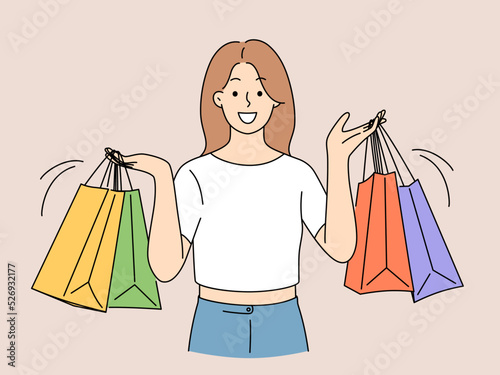 Smiling woman with shopping bags 