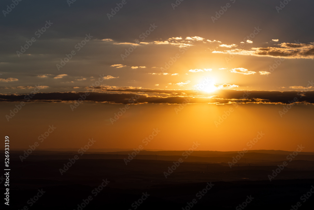 Sun goes down. Wide view Feldberg mountain in Hessen, Germany during sunset. Beautiful landscape with hills and clouds. Sun goes down. Wide view Feldberg mountain in Hessen, Germany during sunset. Beautiful landscape with hills and clouds.