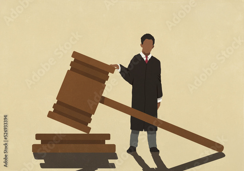 Male judge standing at large gavel
 photo