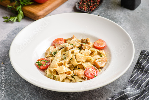 papardelle with porcini mushrooms and tomatoes photo