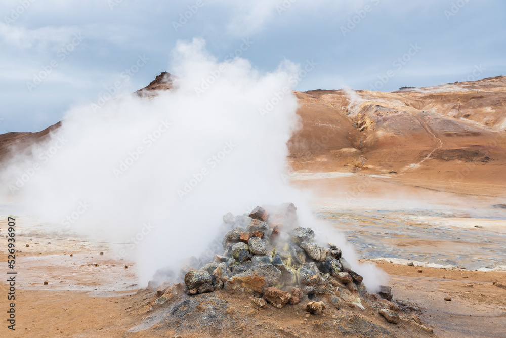 Namafjall, geothermal area in Hverir Hverarönd with tourists strolling. Boiling mud pools and hot springs. Tourist and natural attractions in Iceland Iceland, Europe