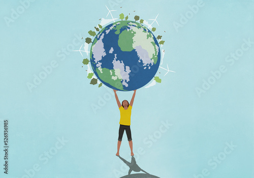Determined, ambitious woman holding globe with wind turbines and green trees overhead
 photo