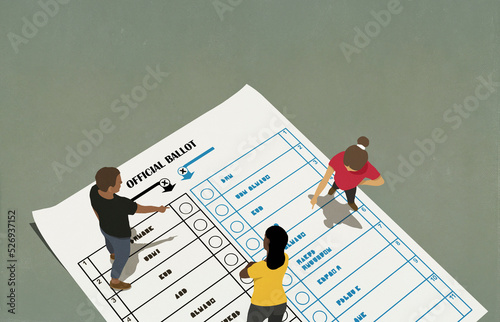 People talking and pointing on voting ballot
 photo