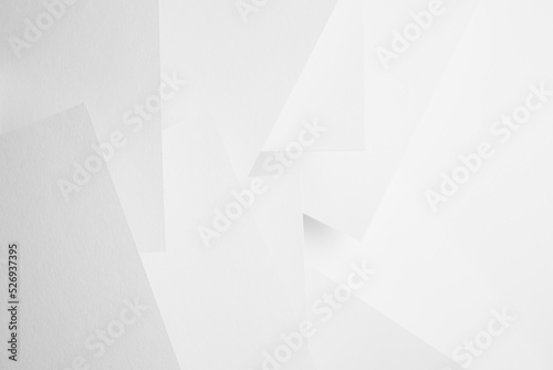 White abstract geometric background with soft light paper surfaces fly as random volumetric pattern with glow and perspective. Simple elegant modern backdrop in minimal style.