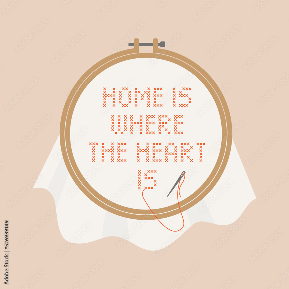 Cross stitch work with embroidery hoop. Home is where the heart is.