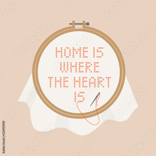 Cross stitch work with embroidery hoop. Home is where the heart is.