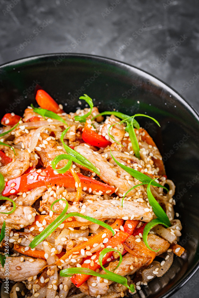 delicious chinese fried noodles on a black background