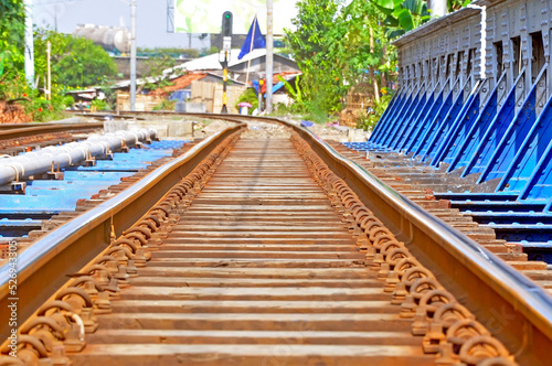 cross jakarta railway track bridge © modisketch