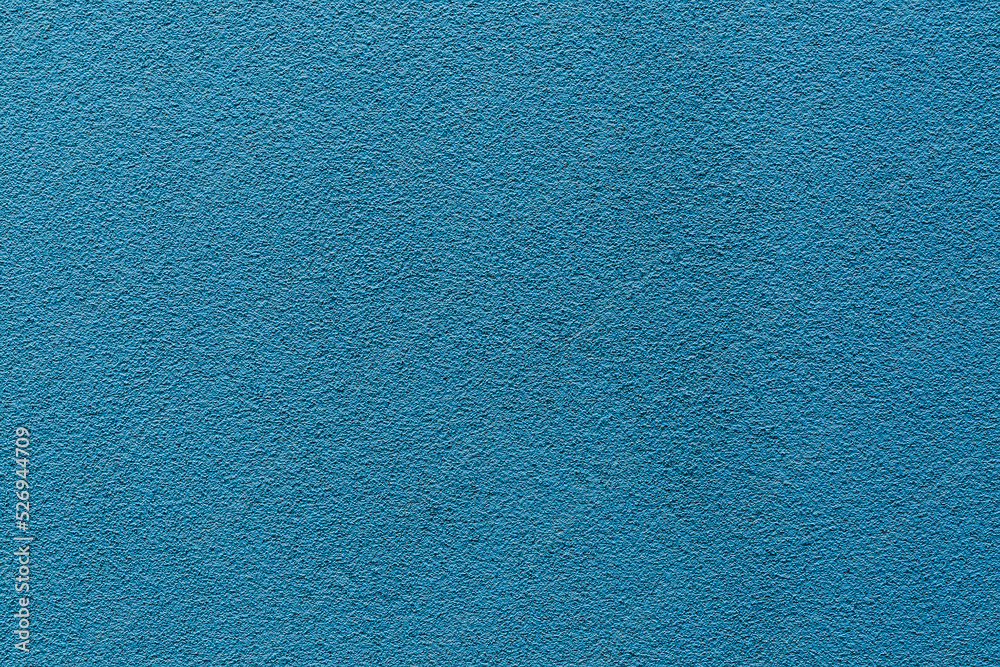 Sample of a texture of blue plaster. Wall finished with a decorative cement stucco. Example of exterior building decoration. Clean uniform grainy background. Banner. Wallpaper. Copy space. Pattern Sample of a texture of blue plaster. Wall finished with a decorative cement stucco. Example of exterior building decoration. Clean uniform grainy background. Banner. Wallpaper. Copy space. Pattern