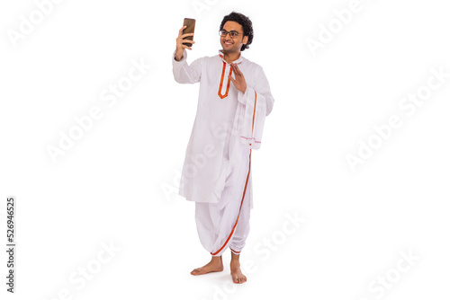 Portrait of Bengali man having videocall through mobile phone