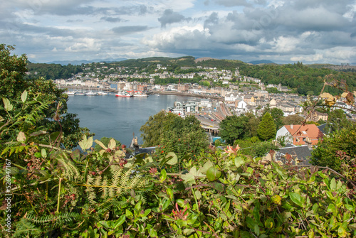 Oban seafront with McCaig's Tower above from Pulpit Hill in Oban resort town within the Argyll and Bute council area of Scotland, United Kingdom