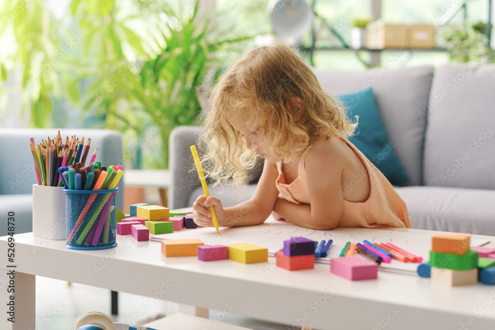 Cute girl coloring with markers Stock Photo | Adobe Stock