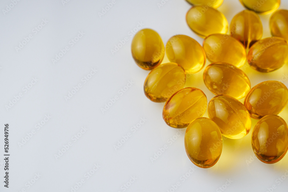 fish oil in omega 3 capsules on a white background fish oil in omega 3 capsules on a white background