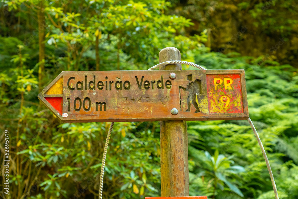 Signs on the trekking trail next to the waterfall in Levada do Caldeirao Verde, Queimadas, Madeira