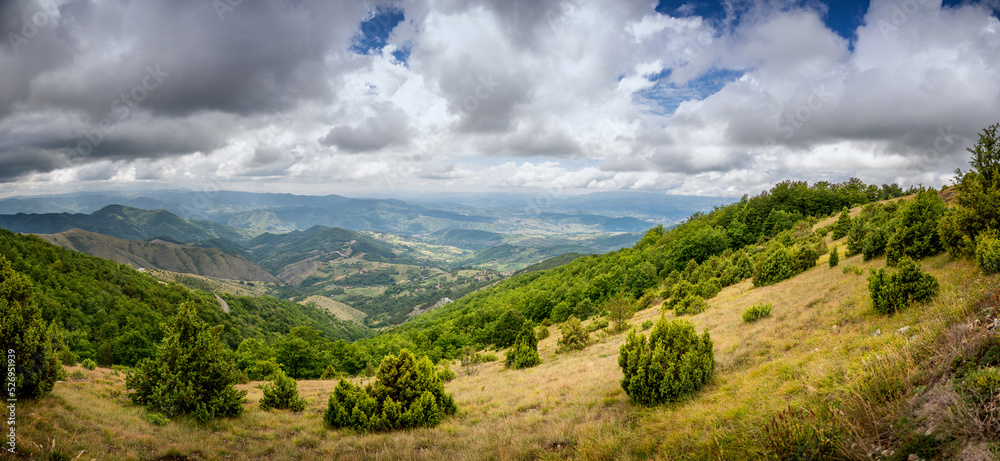 Summer landscape with green hills and blue sky with clouds. Mountain resort in Serbia Kopaonik. Panorama shot