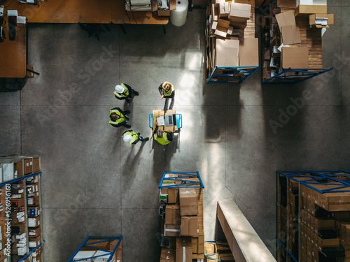 Aerial view of warehouse workers having a meeting