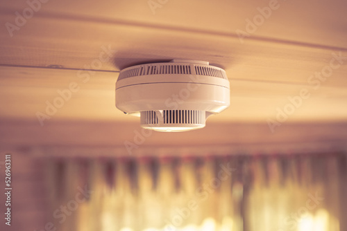 smoke, carbon monoxide detectors in a wooden house	 photo