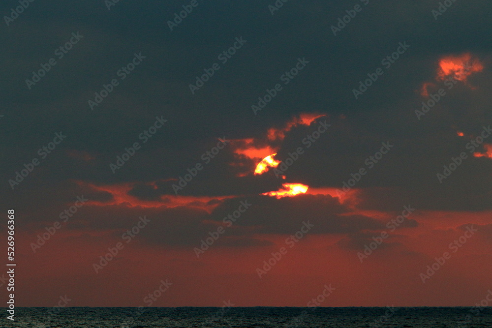 The sun sets below the horizon on the Mediterranean Sea in northern Israel.