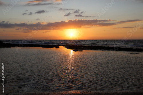The sun sets below the horizon on the Mediterranean Sea in northern Israel.