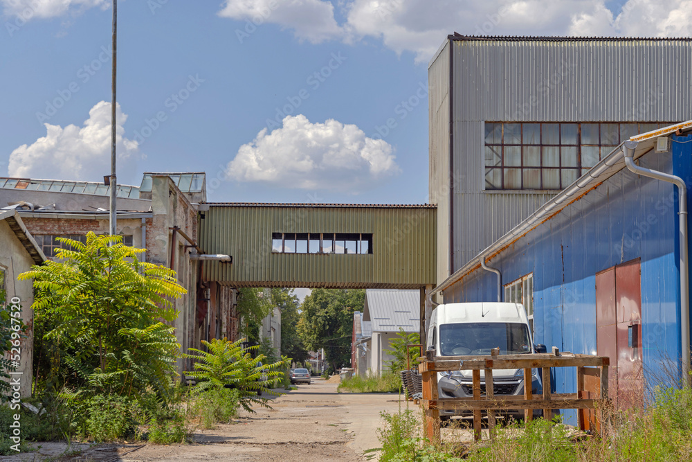 Naklejka premium Bridge Between Factory Buildings