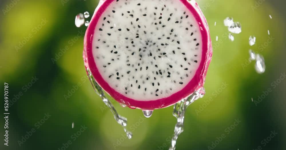 Water Flowing Down Fresh Dragon Fruit Slice in Slow Motion with Bright Backlit Background. Healthy Vegetarian Food Citrus Diet. Juicy Pitahaya Droplet Macro Closeup Detail 4K