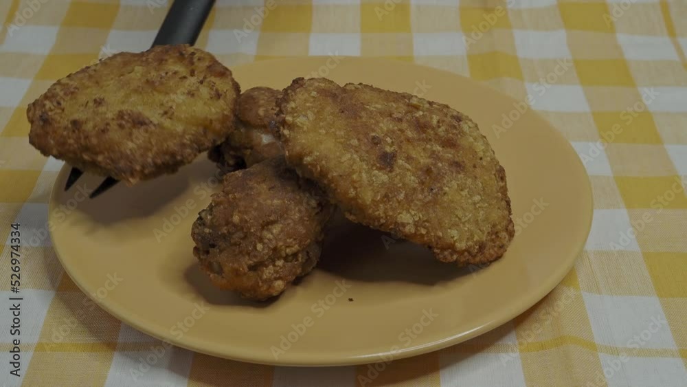 Crispy fried breast and legs from chicken. Homemade breaded schnitzel. Crispy fried breast and legs from chicken. Homemade breaded schnitzel.