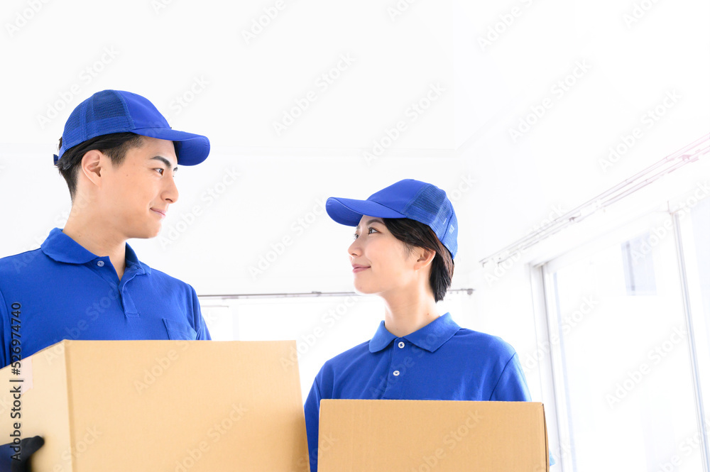 Image of staff carrying cooperatively in a move Image of staff carrying cooperatively in a move
