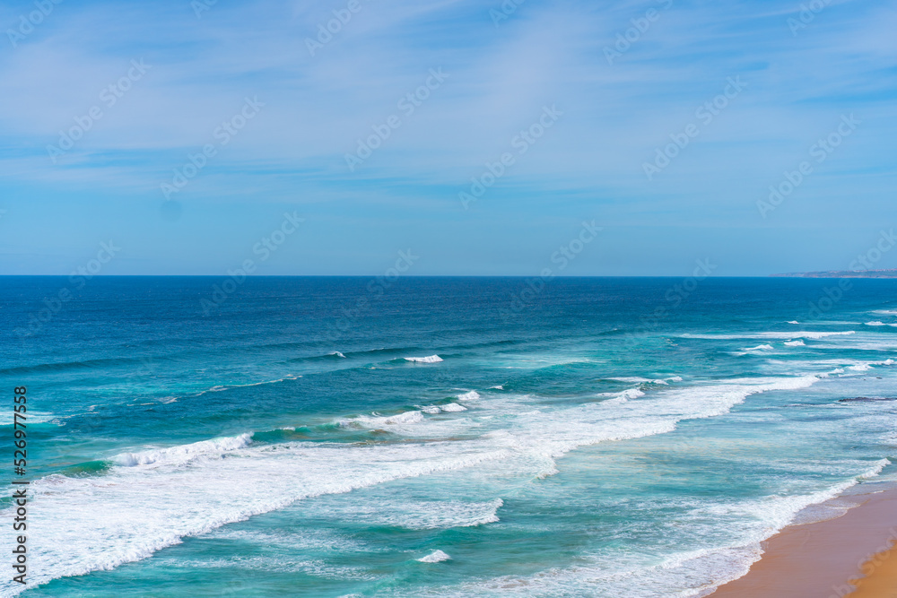 Aerial view of tropical sandy beach and ocean with turquoise water with waves. Sunny day on Atlantic ocean beach Aerial view of tropical sandy beach and ocean with turquoise water with waves. Sunny day on Atlantic ocean beach