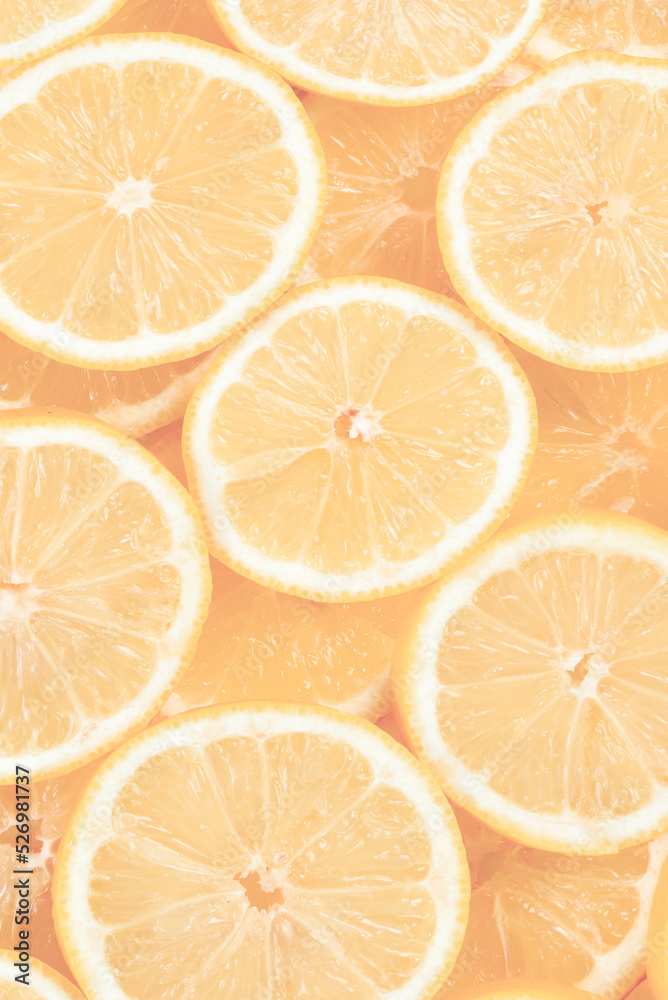 A slices of fresh juicy yellow lemons.  Texture background, pattern.