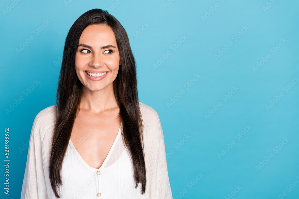 Photo of lovely brunette lady look promo wear white shirt isolated on blue color background Photo of lovely brunette lady look promo wear white shirt isolated on blue color background