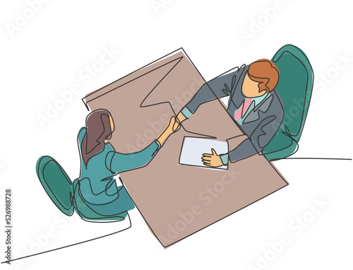 Continuous line drawing of young manager handshake his female worker to congratulate her dealing a project. Business agreement concept. Single line drawing graphic vector illustration