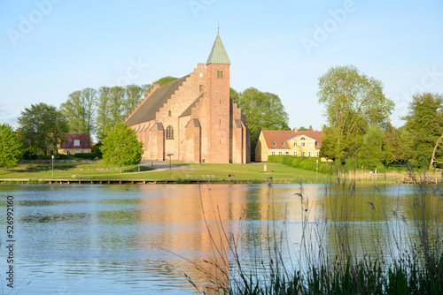 The Maribo Cathedral by the lake Søndersø in the evening sun