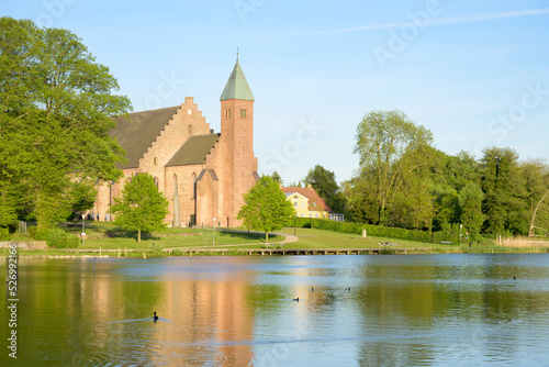Maribo Cathedral seen across the lake Søndersø