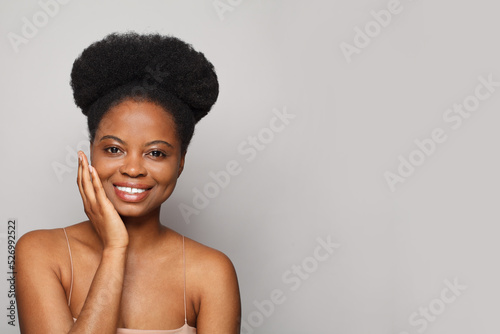 Happy pretty model woman smiling and looking at camera on white background