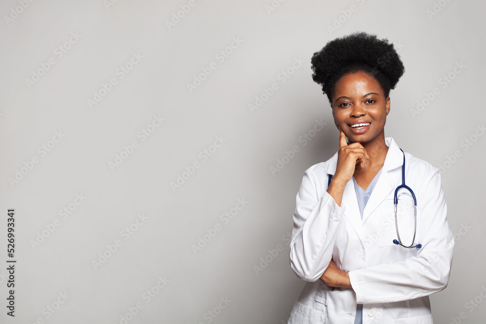 Happy doctor or nurse with stethoscope smiling on white background Happy doctor or nurse with stethoscope smiling on white background