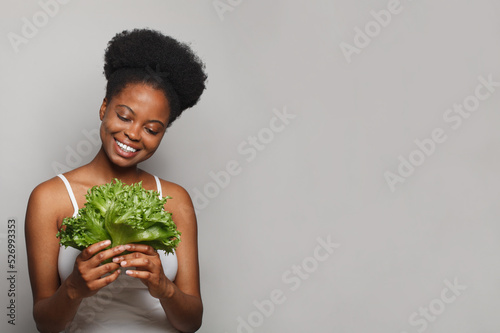 Murais de parede Happy black woman with greens on white banner background