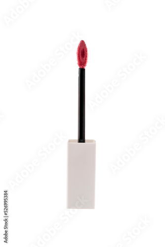 Pink liquid lipstick applicator brush on brright background. photo