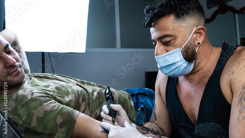 Tattooist and client