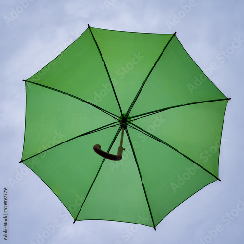 UMBRELLA - Colorful objects on the background of the clouds sky 