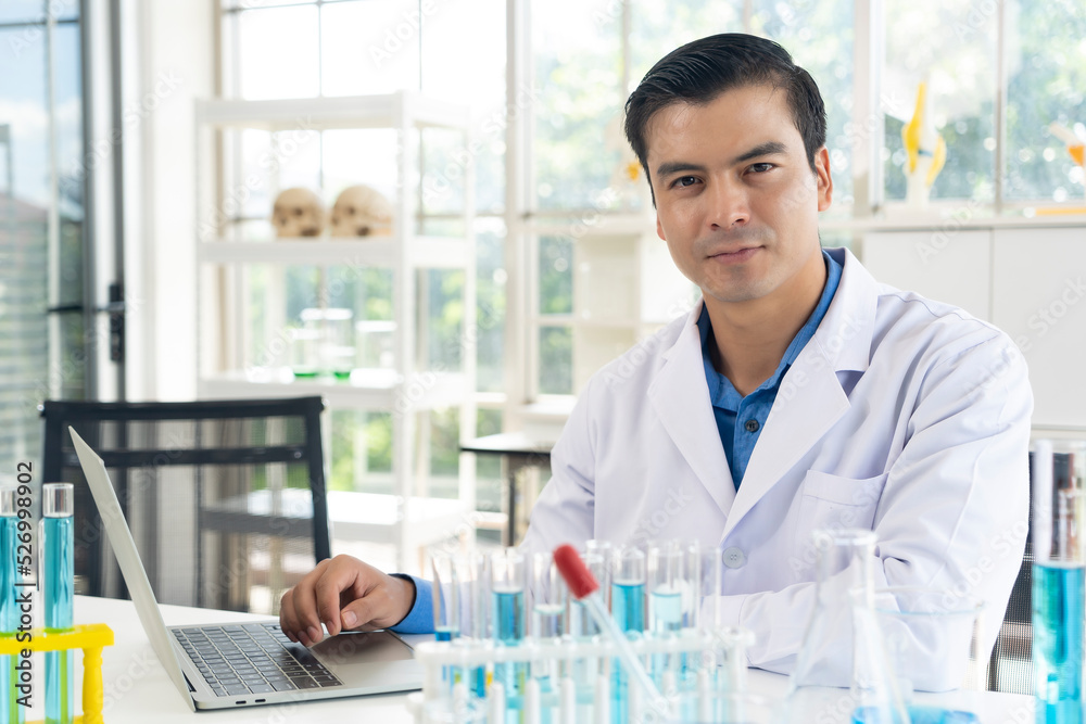Handsome scientist man with test tube at laboratory Handsome scientist man with test tube at laboratory