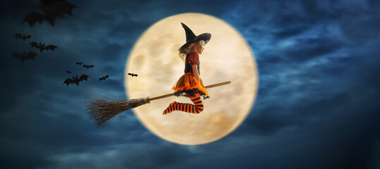 child flies as a witch to helloween with the moon in the background