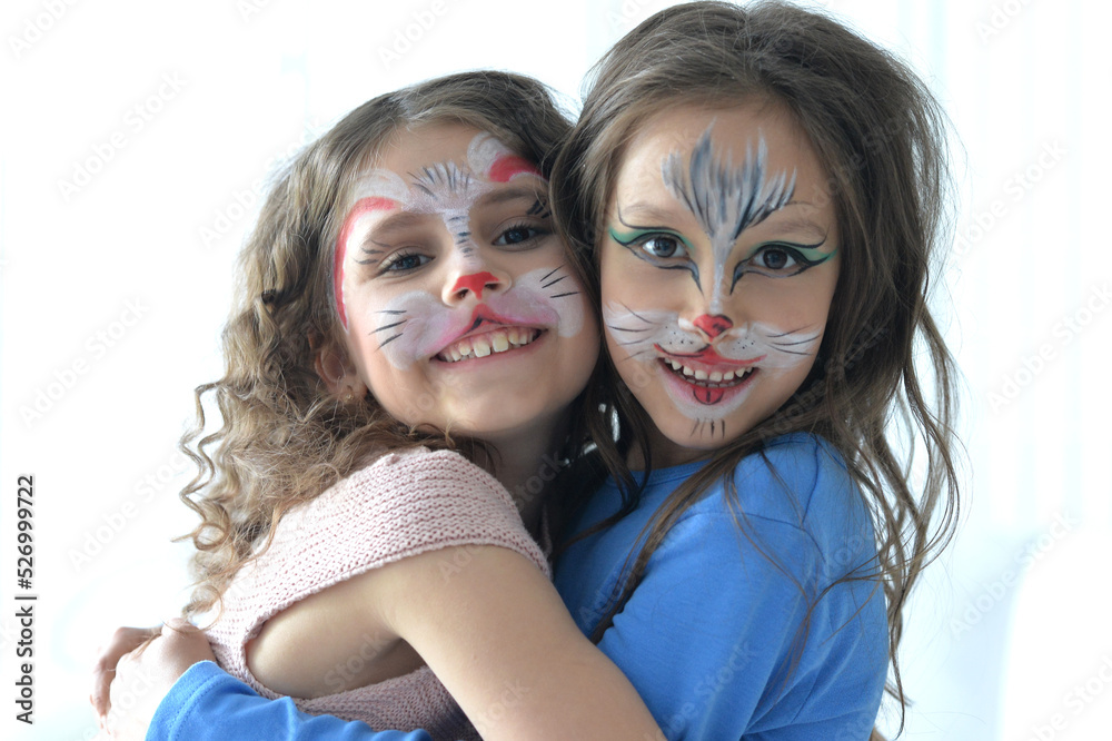 Fototapeta premium Cute little girls with faces painted posing