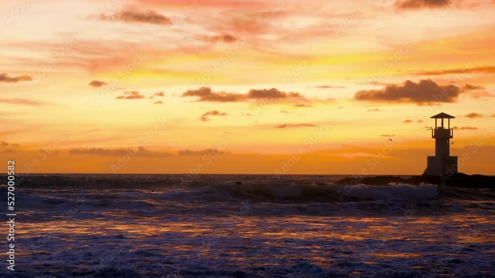 Scenic view of surf people sitting with surfboards in water on sunset
