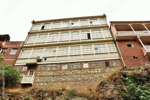 Traditional residential buildings in the old town of Tbilisi on the edge of a sheer cliff