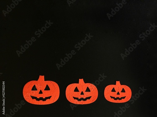 Three Beautiful pumpkin on a black background. Creative halloween concept backdrop. halloween pumpkin craft	