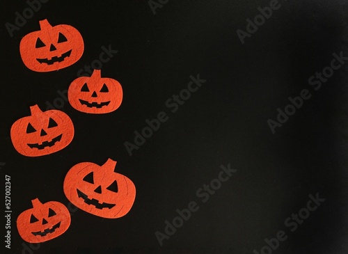 Beautiful pumpkin on a black background. Creative halloween concept backdrop. halloween pumpkin craft	