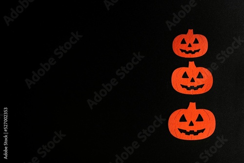 Three Beautiful pumpkin on a black background. Creative halloween concept backdrop. halloween pumpkin craft
