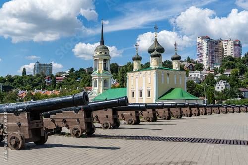 Assumption Admiralty Church and residential area. Cannons on Admiralteyskaya embankment. In the background is Historical place in cradle of Russian Navy. Voronezh, Russia - July 30, 2022.